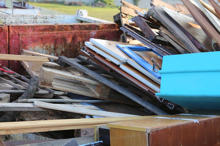 A pile of discarded doors and other wooden fixtures.